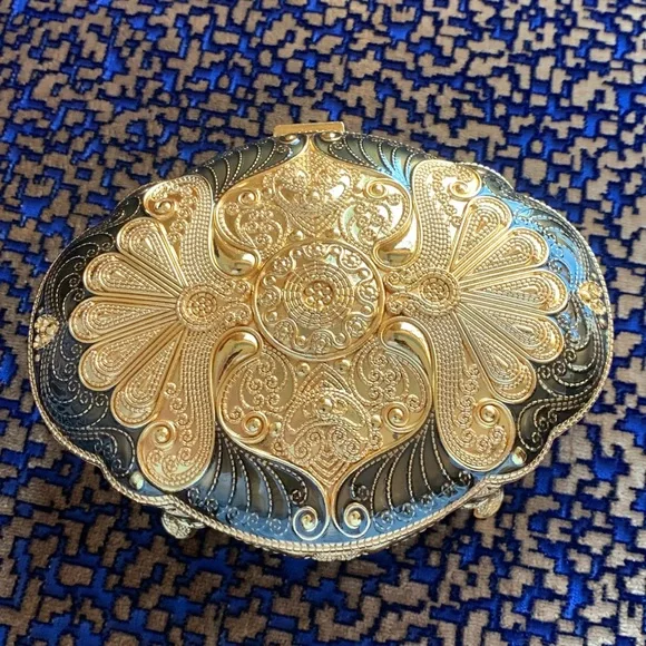 Absolutely stunning jewelry box , golden and black top, made in UAE. Must have!